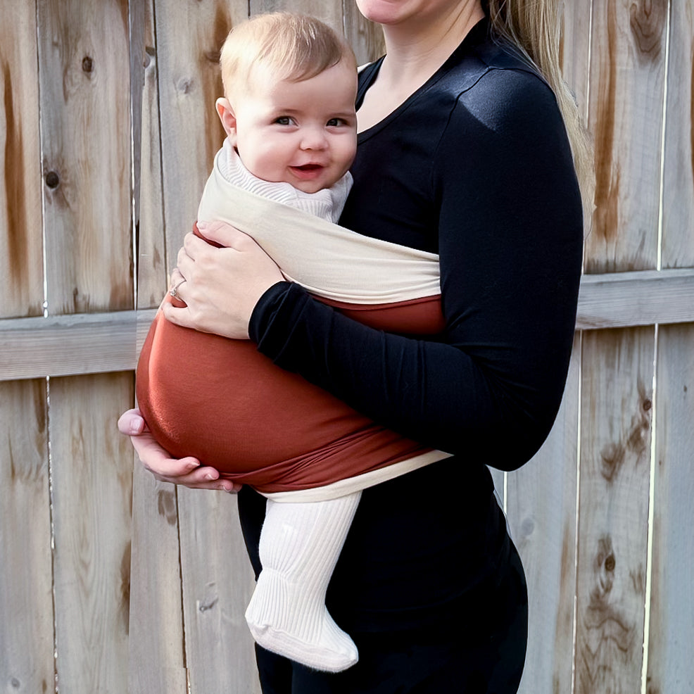 KinCozy Colour-Block Bonding Comforter — parent carrying baby hands-free product photo