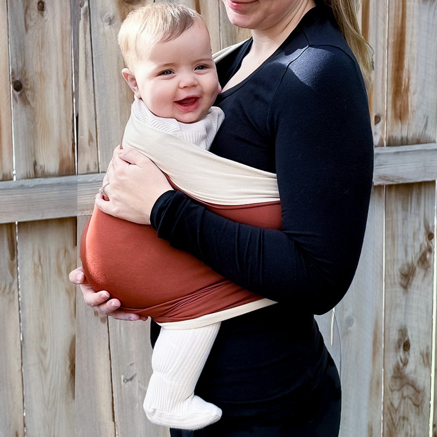 KinCozy Colour-Block Bonding Comforter — parent carrying baby hands-free product photo