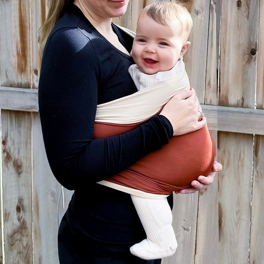 KinCozy Colour-Block Bonding Comforter — parent carrying baby hands-free product photo