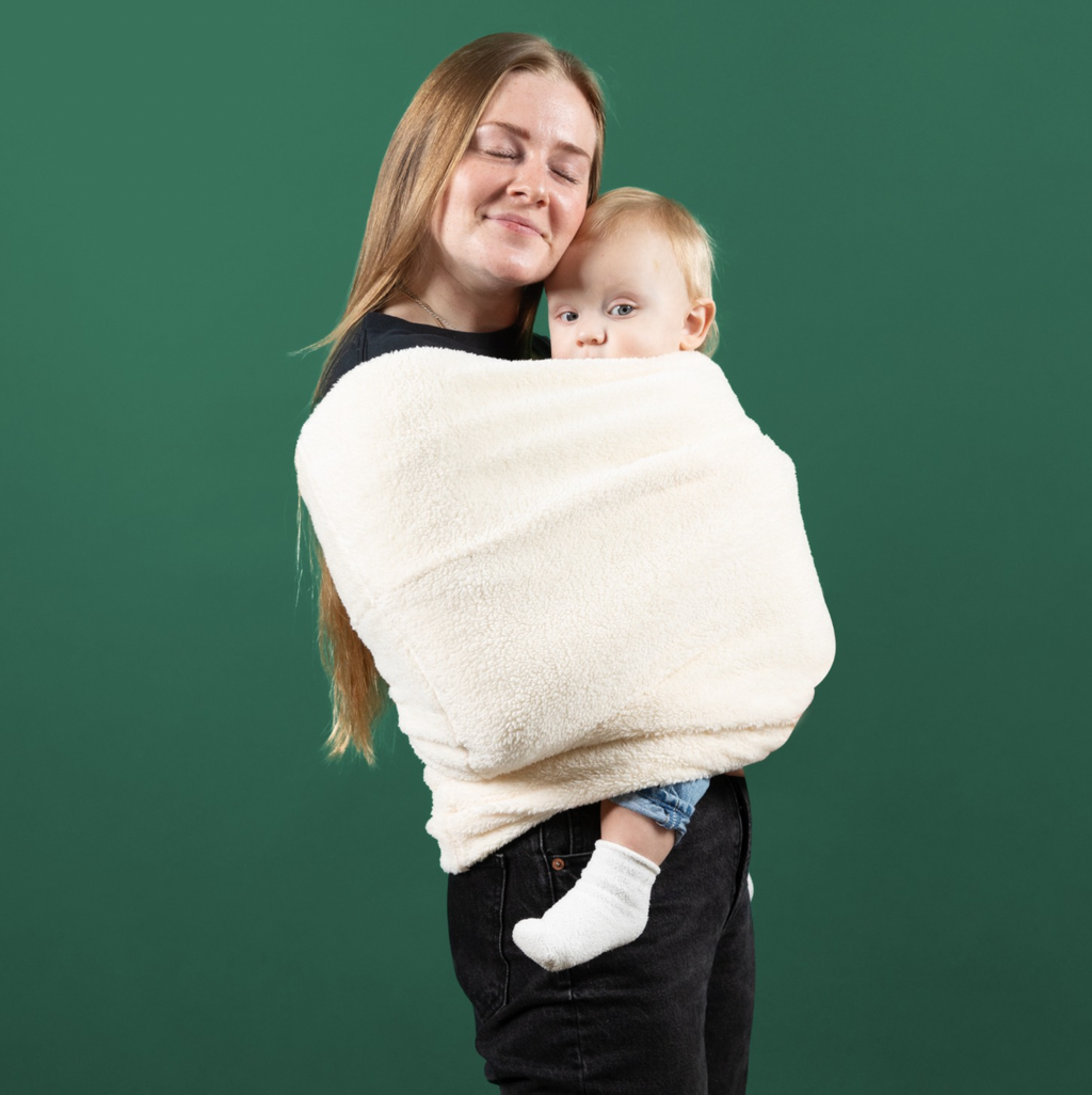Close-up of the sherpa plush fabric and reinforced baby pouch