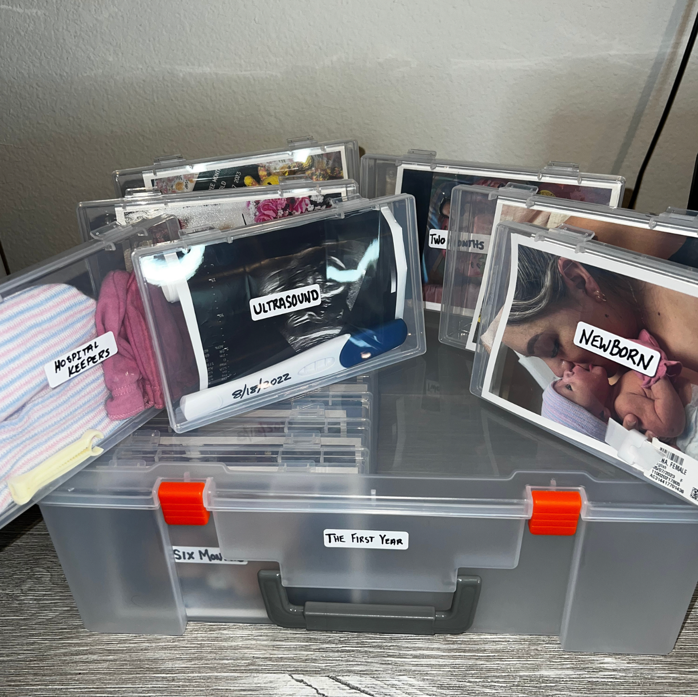 Memory box filled with baby photos and keepsakes